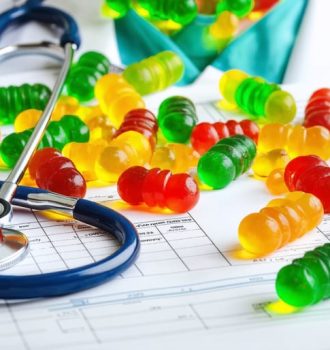 Conceptual portrayal of a medical resident surrounded by colorful CBD gummies, symbolizing focus and stress relief benefits during residency.