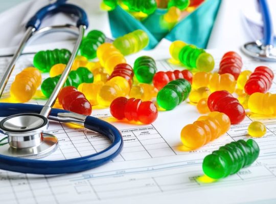 Conceptual portrayal of a medical resident surrounded by colorful CBD gummies, symbolizing focus and stress relief benefits during residency.